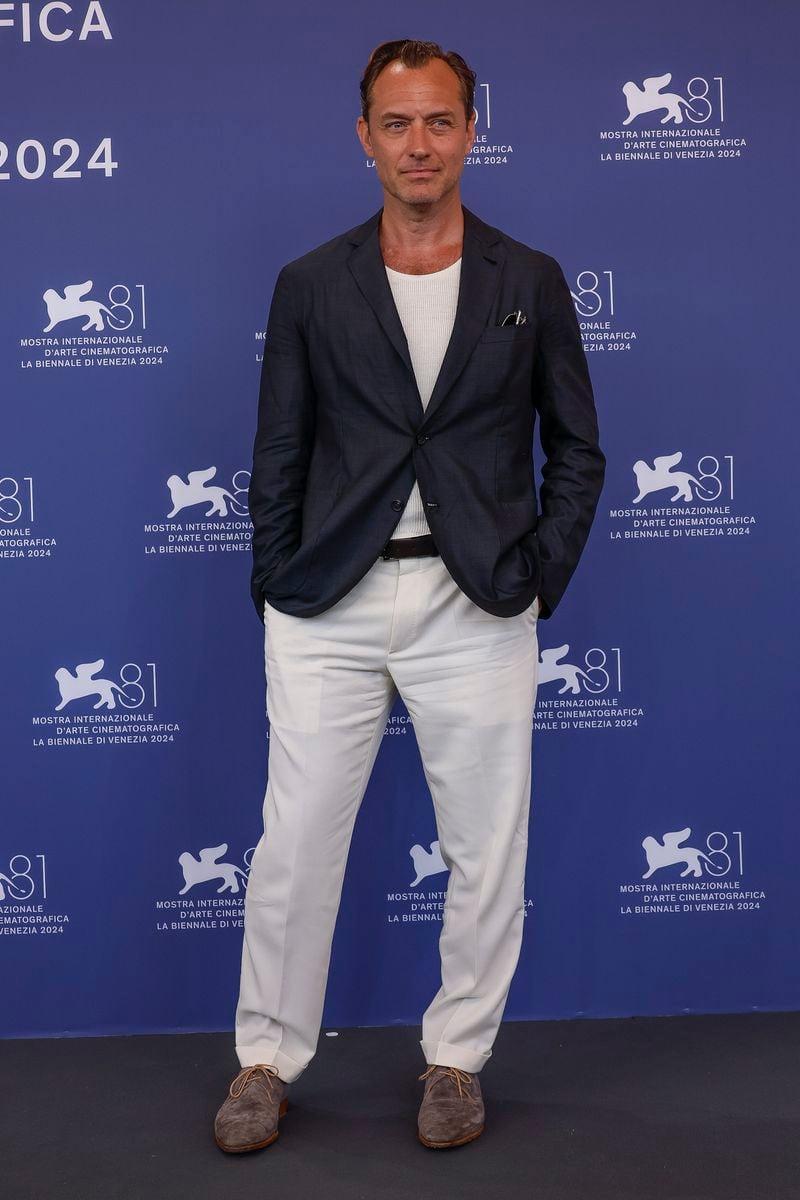 Jude Law poses for photographers at the photo call for the film 'The Order' during the 81st edition of the Venice Film Festival in Venice, Italy, on Saturday, Aug. 31, 2024. (Photo by Joel C Ryan/Invision/AP)