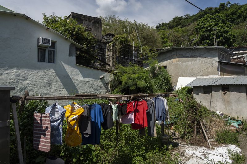 Laundry are hung to dry at the Cha Kwo Ling village in east Kowloon, Hong Kong, Sunday, Aug. 25, 2024. (AP Photo/Chan Long Hei)