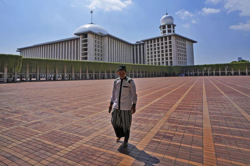 A man walks at Istiqlal Mosque after Friday prayers in Jakarta, Indonesia, Friday, Aug. 9, 2024. (AP Photo/Tatan Syuflana)