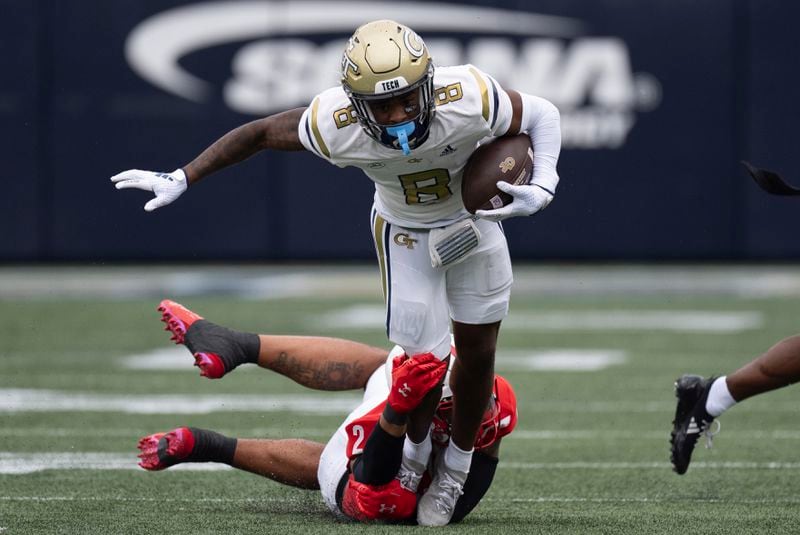 Georgia Tech wide receiver Avery Boyd (9) tries to escape from Virginia Military Institute defensive back Shamus Jones (2) after a catch during the first half of a NCAA college football game Sunday, Sept. 14, 2024, in Atlanta,. (AP Photo/John Bazemore)