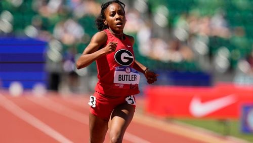 Aaliyah Butler wins a heat women's 400-meter run during the U.S. Track and Field Olympic Team Trials Friday, June 21, 2024, in Eugene, Ore. (AP Photo/Charlie Neibergall)