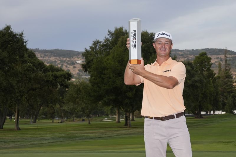 Patton Kizzire holds up the trophy after winning the Procore Championship golf tournament at Silverado Resort North Course, Sunday, Sept. 15, 2024, in Napa, Calif. (AP Photo/Godofredo A. Vásquez)