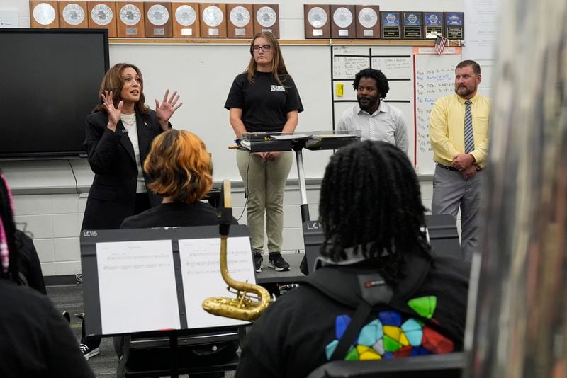 Democratic presidential nominee Vice President Kamala Harris speaks to marching band members at Liberty County High School in Hinesville, Ga., Wednesday, Aug. 28, 2024. (AP Photo/Jacquelyn Martin)