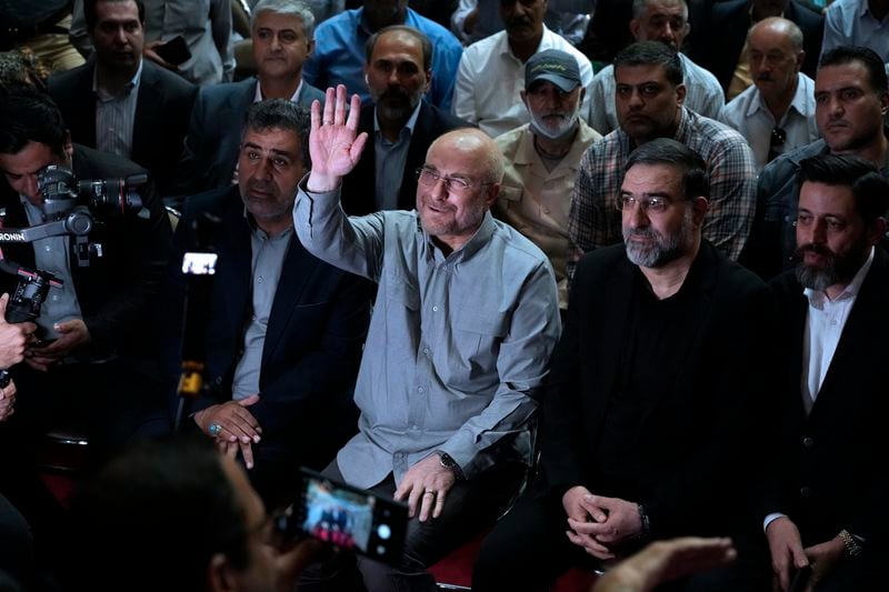 Mohammad Bagher Qalibaf, the most prominent candidate for the June 28, presidential election, who is Iran's parliament speaker, waves to media in his campaign rally in Tehran, Iran, Tuesday, June 18, 2024. (AP Photo/Vahid Salemi)