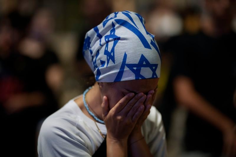 A demonstrator reacts during a protest against Prime Minister Benjamin Netanyahu's government and call for the release of hostages held in the Gaza Strip by the Hamas militant group, in Tel Aviv, Israel, Saturday, Sept. 7, 2024. (AP Photo/Leo Correa)