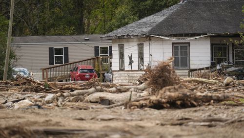 Homes lie in a debris field in the aftermath of Hurricane Helene, Thursday, Oct. 3, 2024, in Pensacola, N.C. (AP Photo/Mike Stewart)