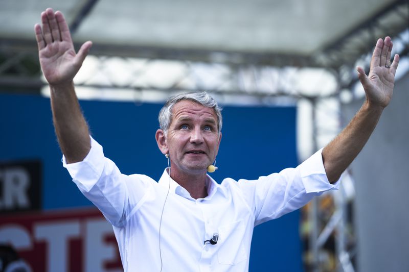 Bjoern Hoecke top candidate in Thuringia of the far-right Alternative for Germany, AfD, party waves to supporters during an election campaign rally in Suhl, Germany, Aug. 13, 2024. (AP Photo/Markus Schreiber)