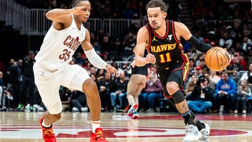 Atlanta Hawks guard Trae Young (11) dribbles down court  during a game between the Cleveland Cavaliers and the Atlanta Hawks on Saturday, Jan. 20, 2024, at State Farm Arena in Atlanta, Georgia. The Hawks announced that Young entered the NBA’s concussion protocol after leaving the game. (Jason Allen for the Atlanta Journal Constitution)