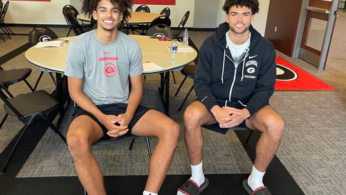Brothers Asa (left) and Jaden Newell are reunited as members of the Georgia basketball team after spending the past two years apart. Asa, a 5-star recruiting prospect, has been playing high school ball in northwest Florida while Jaden played for the Bulldogs as a walk-on forward the past two years. Now both are scholarship players for coach Mike White's third Georgia basketball team. The brothers sat down to talk to reporters Friday, July 12, 2024 before a workout at UGA's basketball training facility in Athens. (Photo by Chip Towers/ctowers@ajc.com)