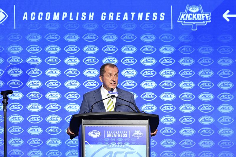 FILE - Atlantic Coast Conference commissioner Jim Phillips speaks during an NCAA college football news conference at the ACC media days, Monday, July 22, 2024, in Charlotte, N.C. (AP Photo/Matt Kelley, File)