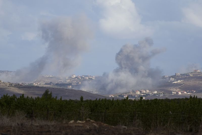 Smoke rises following Israeli bombardment in southern Lebanon as seen from northern Israel, Wednesday, Oct. 2, 2024. (AP Photo/Baz Ratner)