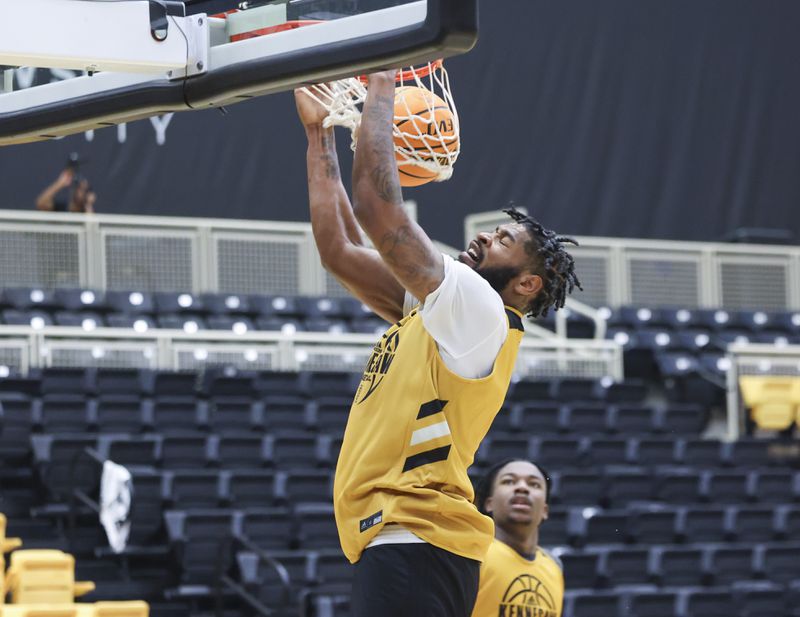 Kennesaw State University forward Demond Robinson dunks during practice at the Convocation Center on the Kennesaw State University campus, Tuesday, October 24, 2023, in Kennesaw, Ga. (Jason Getz / Jason.Getz@ajc.com)