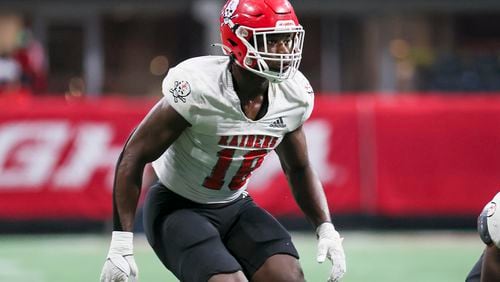 Savannah Christian defensive end LaDamion Guyton (18) prepares for a play against Cedar Grove during the Class 3A GHSA State Championship game at Mercedes-Benz Stadium, Wednesday, December. 13, 2023, in Atlanta. (Jason Getz / Jason.Getz@ajc.com)