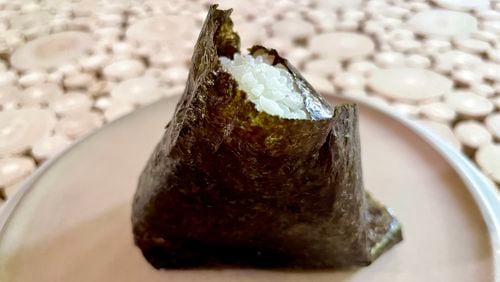 The grilled salmon onigiri at Gohan market comes wrapped in nori (dried seaweed). (Angela Hansberger for The Atlanta Journal-Constitution)