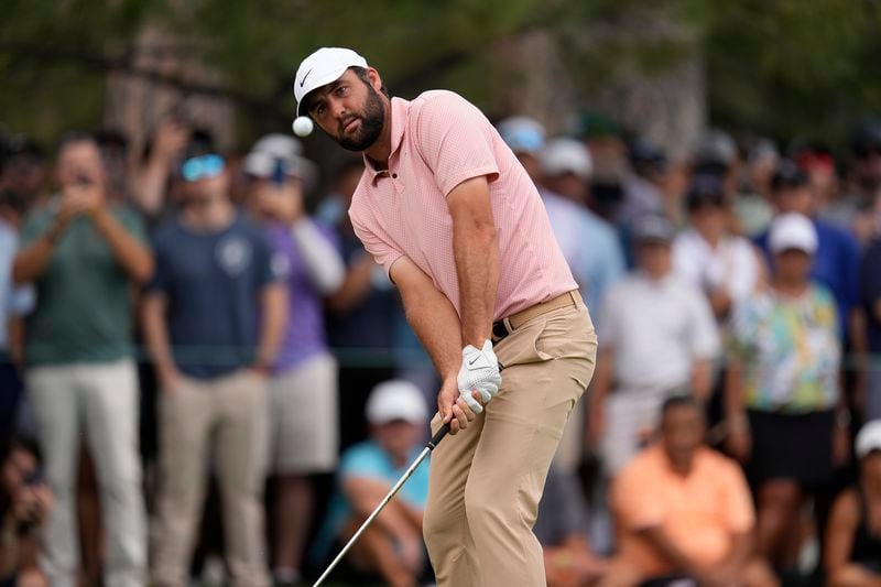 Scottie Scheffler hits on the 14th hole during the second round of the BMW Championship golf event at Castle Pines Golf Club, Friday, Aug. 23, 2024, in Castle Rock, Colo. (AP Photo/Matt York)