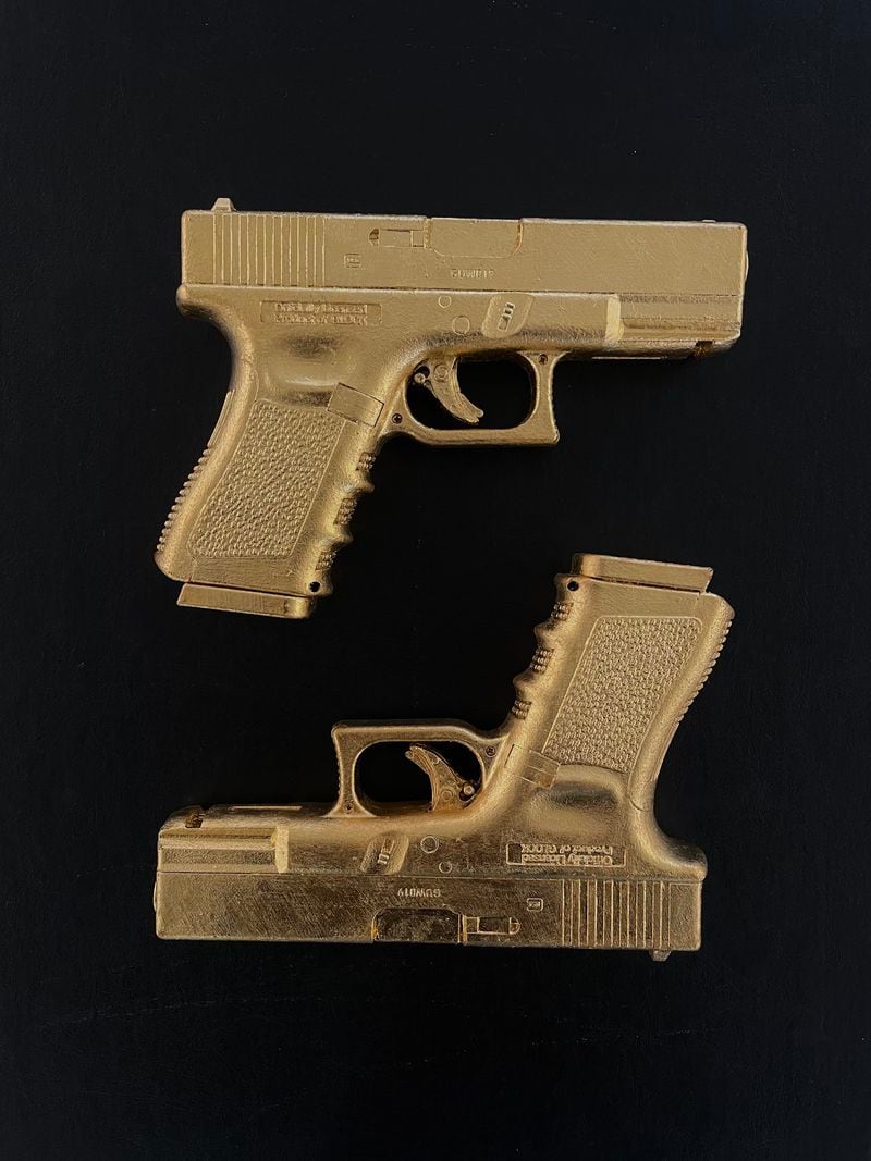 At Maune Contemporary, Jacob Deimler's 24-karat gold-plated replicas of Glock 19s. Photo: Courtesy of Maune Contemporary