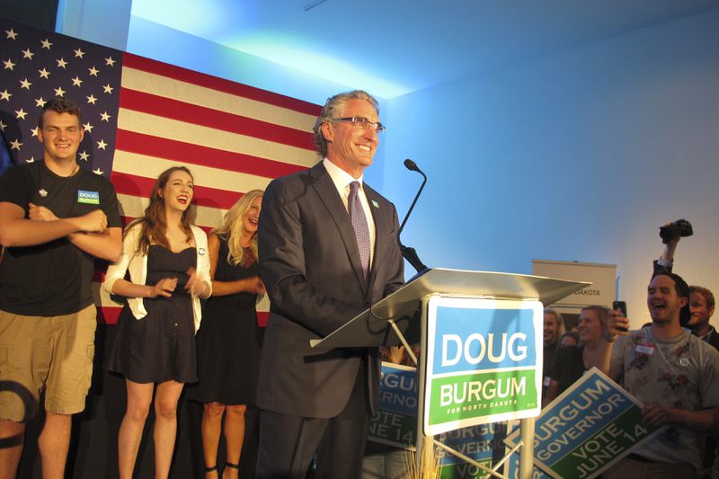 FILE - Republican gubernatorial candidate Doug Burgum talks to supporters at an art gallery in downtown Fargo, N.D., after Burgum won the GOP primary vote June 14, 2016. (AP Photo/Dave Kolpack, File)