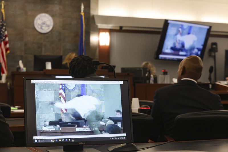 A monitor display the moment when Deobra Redden attacked District Judge Mary Kay Holthus during Redden's trial at the Regional Justice Center in Las Vegas, Thursday, Sept. 5, 2024. (Rachel Aston/Las Vegas Review-Journal via AP)