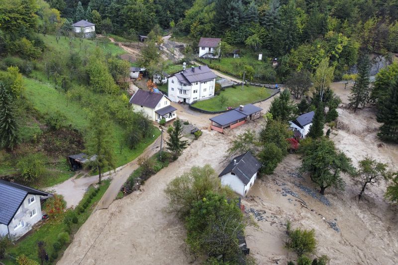 Flooded houses after a heavy rain in the village of Luke, near Bosnian town of Fojnica, 50 kms west of Sarajevo, Bosnia, Friday, Oct. 4, 2024. (AP Photo/Robert Oroz)