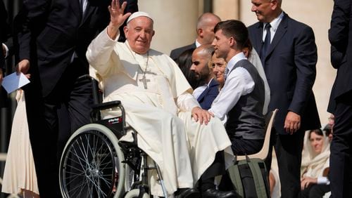 Pope Francis waves as he leaves after his weekly general audience in St. Peter's Square at The Vatican, Wednesday, Aug.28, 2024. (AP Photo/Andrew Medichini)