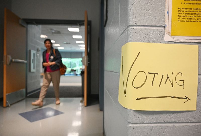 Gwinnett County resident Dana Pulliam leaves after voting at Lucky Shoals Park.