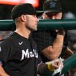 Miami Marlins manager Skip Schumaker, left, listens to Marlins pitching coach Mel Stottlemyre, right, in the dugout during the sixth inning of a baseball game against the Washington Nationals, Thursday, Sept. 12, 2024, in Washington. (AP Photo/John McDonnell)