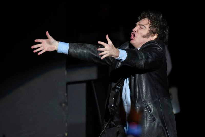 Argentine President Javier Milei sings at a promotional event for his new book in Buenos Aires, Argentina, Wednesday, May 22, 2024. (AP Photo/Gustavo Garello)