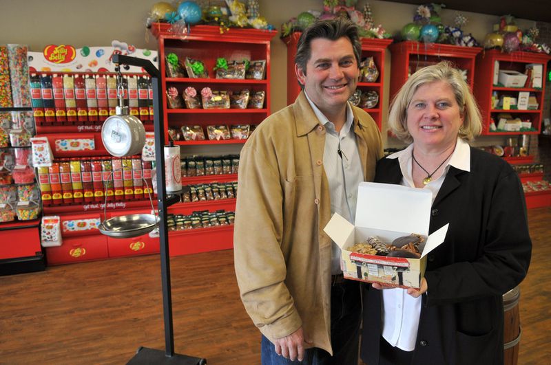 Tim Strickland stands alongside his sister Jennifer, inside the newest River Street Sweets location in Habersham Village.