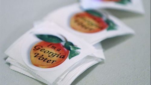 <p>&#39;I&#39;m a Georgia Voter&#39; stickers are available for people to cast their ballots during a special election in Georgia&#39;s 6th Congressional District special election at St. Bede&#39;s Episcopal Church on June 20, 2017. (Photo by Joe Raedle/Getty Images)</p>