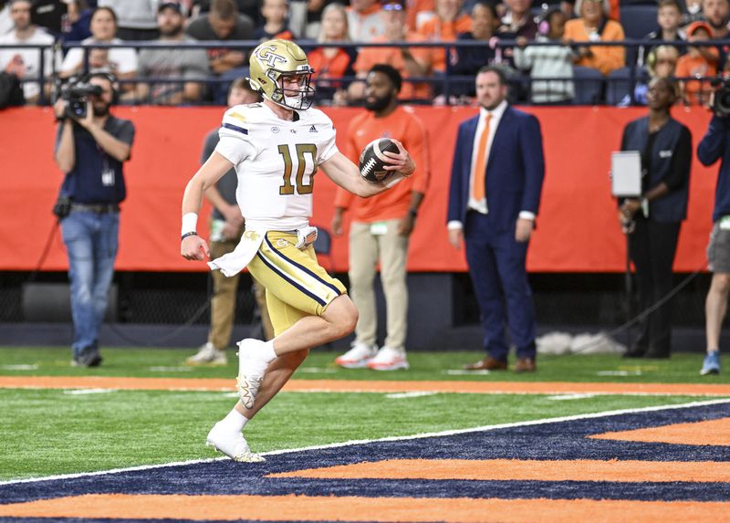 Georgia Tech quarterback Haynes King (10) runs for a touchdown against Syracuse during the first half of an NCAA football game on Saturday, Sept. 7, 2024 in Syracuse, N.Y. (AP Photo/Hans Pennink)