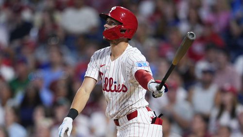 Philadelphia Phillies' Trea Turner watches his two-run home run off Tampa Bay Rays' Taj Bradley during the third inning of a baseball game, Tuesday, Sept. 10, 2024, in Philadelphia. (AP Photo/Derik Hamilton)