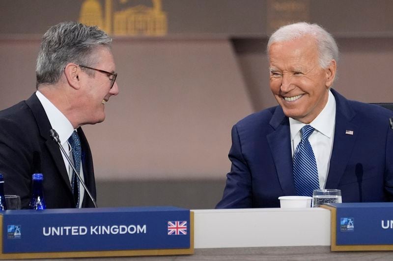President Joe Biden talks with British Prime Minister Keir Starmer before the opening session of the NATO Summit, Wednesday, July 10, 2024, in Washington. (AP Photo/Evan Vucci)