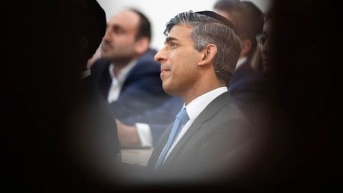 Britain's Prime Minister Rishi Sunak looks on during a visit to Machzike Hadath Synagogue, in Golders Green, while on the general election campaign trail, in north west London, Sunday June 30, 2024. (James Manning/Pool Photo via AP)