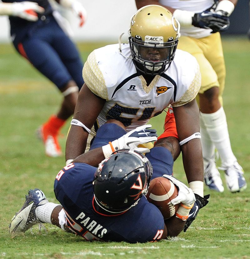 September 15, 2012 -Atlanta: Georgia Tech's Quayshawn Nealy (54) stands over Virginia's Kevin Parks (25) after delivering a hard hit during their game at Bobby Dodd Stadium on Saturday, September 15, 2012. Georgia Tech won the game 56 to 20. JOHNNY CRAWFORD /JCRAWFORD@AJC.COM Georgia Tech linebacker Quayshawn Nealy sounded a positive note Sunday at the ACC Kickoff in Greensboro, N.C.