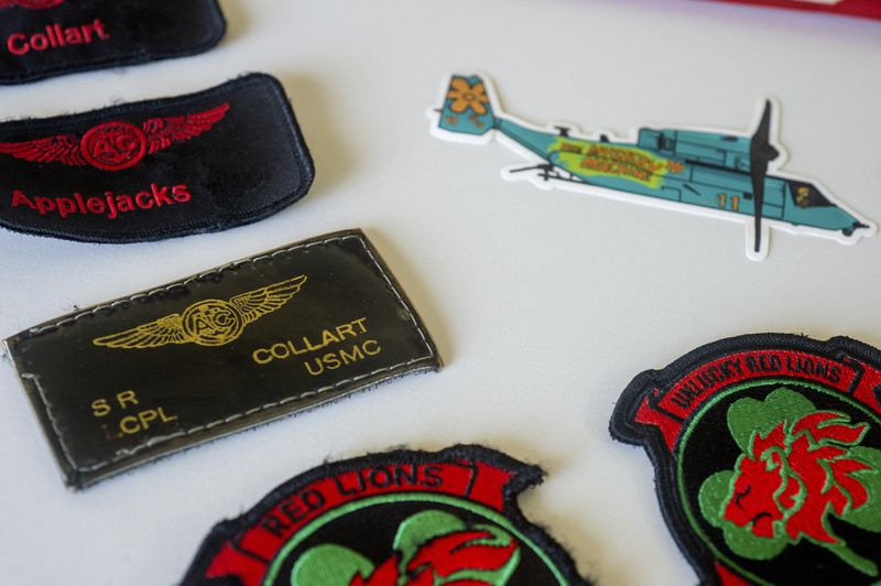 Patches belonging to Marine Corporal Spencer R. Collart are seen at the home of his parents in Arlington, Va., Thursday, June 19, 2024. Collart was killed along with two other Marines when the MV-22B Osprey aircraft they were on crashed during drills on a north Australian island on August 27, 2023. (AP Photo/Rod Lamkey, Jr.)