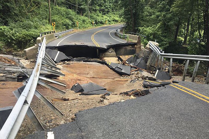 Damage from flood waters is shown on Cottage Street in Monroe, Conn., Monday, Aug. 19, 2024. (Arnold Gold/Hearst Connecticut Media)