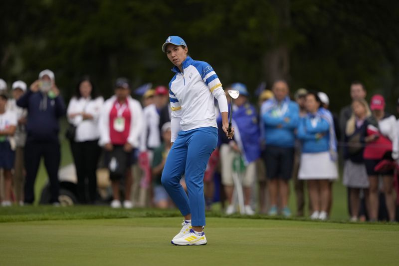 Europe's Carlota Ciganda watches her putt on the first hole during a Solheim Cup golf tournament foursomes match at Robert Trent Jones Golf Club, Friday, Sept. 13, 2024, in Gainesville, VA. (AP Photo/Matt York)