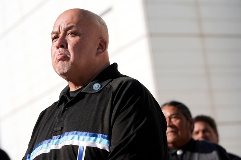 Duane Clark, chairman of the Hualapai Tribe, pauses as he speaks during a news conference in front of U.S. District Court as he joins other members of the Hualapai Tribe gathered to try to persuade a federal judge to extend a temporary ban on exploratory drilling for a lithium project Tuesday, Sept. 17, 2024, in Phoenix. (AP Photo/Ross D. Franklin)