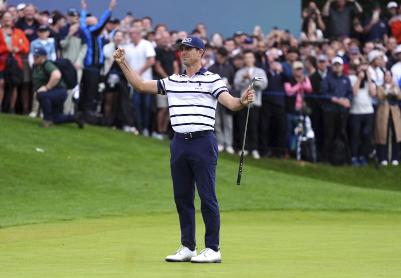 Billy Horschel of the U.S. celebrates victory, following day four of the PGA Championship at Wentworth Golf Club in Virginia Water, England, Sunday Sept. 22, 2024. (Zac Goodwin/PA via AP)