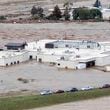 In this image made from a video provided by NewsNation, people can be seen on the roof of the Unicoi County Hospital in Erwin, Tenn., on Friday, Sept. 27, 2024. (NewsNation via AP)