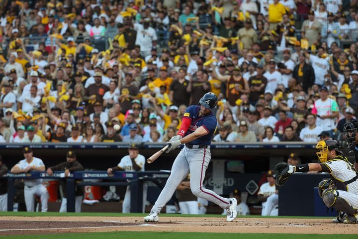 Atlanta Brave’ Matt Olson (28) hits a single against the San Diego Padres during the first inning of the National League Division Series Wild Card Game One at Petco Park in San Diego on Tuesday, Oct. 1, 2024.   (Jason Getz / Jason.Getz@ajc.com)