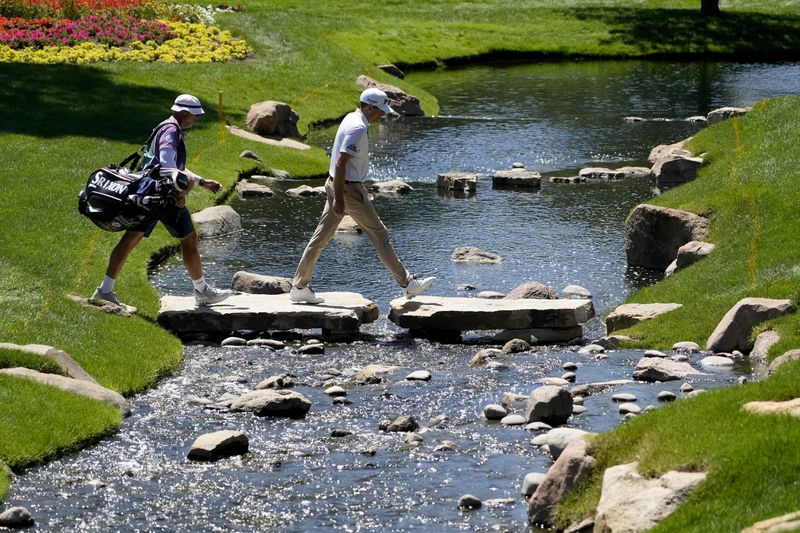 Keegan Bradley walks to the 14th green during the first round of the BMW Championship golf event at Castle Pines Golf Club, Thursday, Aug. 22, 2024, in Castle Rock, Colo. (AP Photo/Matt York)