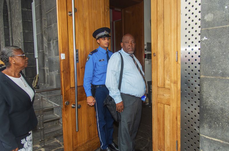 Chagossian Olivier Bancoult, right, outside the Mauritian Prime Minister's office in Port Louis, Mauritius, Thursday, Oct. 3, 2024, after the news that the U.K. had agreed to hand sovereignty of the long-contested Chagos Islands to Mauritius. (Sokrah Kiranchand/l'Express Mauritius via AP)