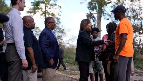 Democratic presidential nominee Vice President Kamala Harris greets people who were impacted by Hurricane Helene in Augusta, Ga., Wednesday, Oct. 2, 2024, as from left, Sen. Jon Ossoff, D-Ga., FEMA deputy direct Erik Hooks and Augusta Mayor Garnett Johnson watch. (AP Photo/Carolyn Kaster)