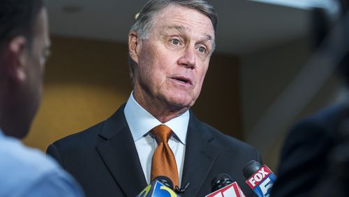 U.S. Sen. David Perdue (R-GA) speaks with media following a talk at the Kiwanis Atlanta Club luncheon meeting at the Loudermilk Conference Center in downtown Atlanta, Tuesday, August 6, 2019.  (Alyssa Pointer/alyssa.pointer@ajc.com)