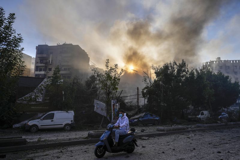 Smoke rises from the site of an Israeli airstrike in Dahiyeh, Beirut, Lebanon, Thursday, Oct. 3, 2024. (AP Photo/Hassan Ammar)