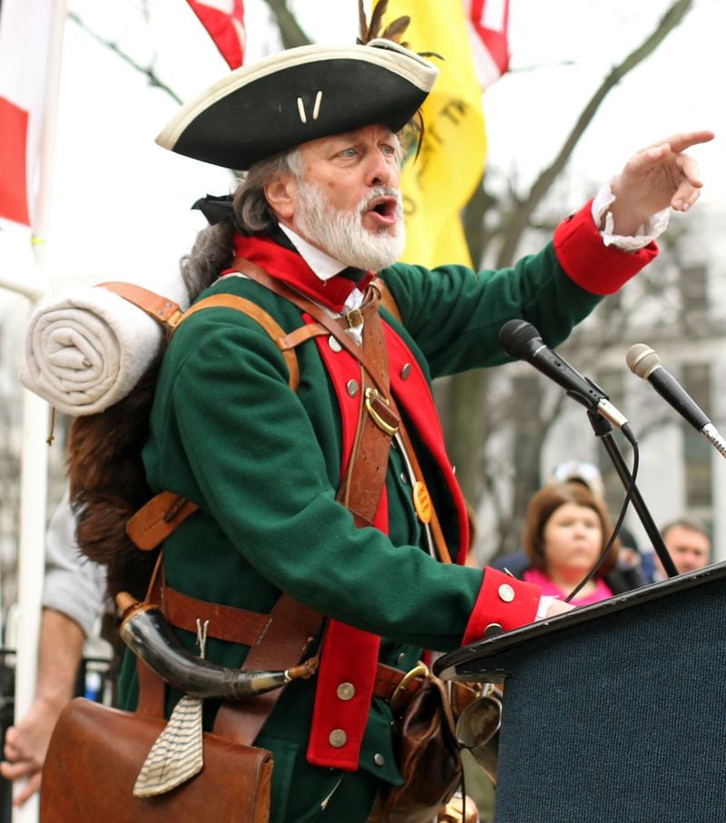 February 8, 2013 - Atlanta, Ga: William Temple, of Brunswick, Ga., wearing revolutionary attire, argues with a man during the Georgia State Capitol Pro-Gun Rally at the main entrance to the Georgia State Capitol on Washington Street Friday morning in Atlanta, Ga., February 8, 2013. This group of around 150 people, rallied for the purpose to stand together peacefully in protest of the gun bans facing society. Openly carrying firearms was widely encouraged by protestors as it exercises their 1st and 2nd Amendment Rights. This was a nationwide rally. JASON GETZ / JGETZ@AJC.COM