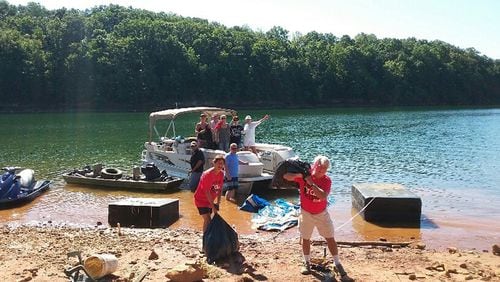 Volunteers assist at a past Shore Sweep of the Lake Lanier Association. More than 1,000 people are expected to tur out Saturday, Sept. 15, to participate in this year’s lake cleanup. PAUL PERDUE/LAKE LANIER ASSOCIATION via Facebook