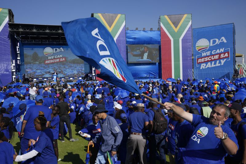 Supporters of the main opposition Democratic Alliance (DA) party attend a final election rally in Benoni, South Africa, Sunday, May 26, 2024. South African will vote in the 2024 general elections May 29. (AP Photo/Themba Hadebe)