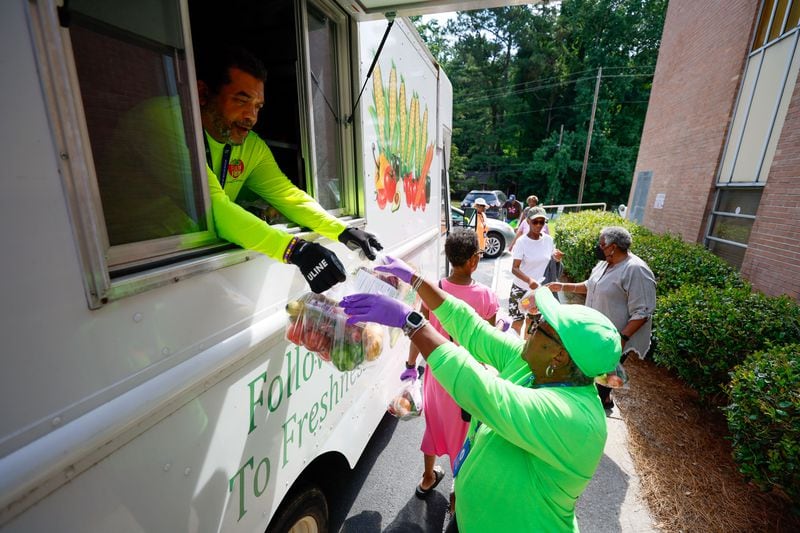 With the Fulton Fresh Mobile Market truck, Eric McIntosh and Shirley Dodd get ready to hand out free produce bags to attendees of a nutrition Class at St Mark AME Church on Tuesday, June 18, 2024. The area is considered a “food desert” because there are no grocery stores.
(Miguel Martinez / AJC)
